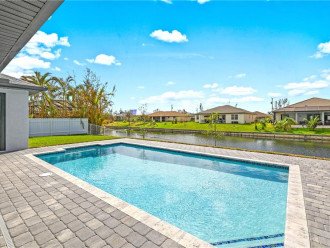 Enjoy the heated, saltwater, south facing pool while taking in the views of the freshwater canal.