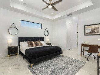 Master suite with a Casper brand king sized bed and designated work station.