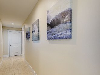 201 69th AMI Beach Home, Hallway with Manatee Pictures