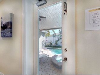 201 69th AMI Beach Home, Hallway with Manatee Pictures