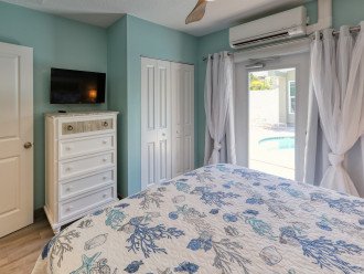 Master Bedroom of Pelican Suite with direct Pool Access at AMI Beach Lagoon