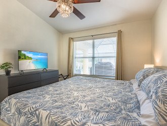 Master bedroom with king bed and Smart TV.
