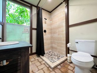 outdoor bathroom located by the pool