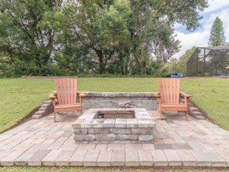 brand new paver patio fire pit with views of the lake
