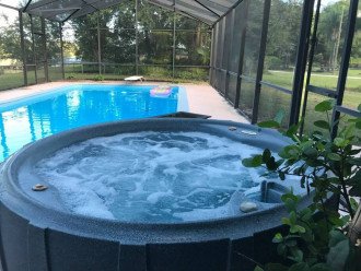 Stay warm year round in the poolside hot tub