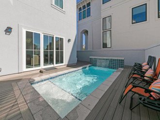 Lounge Pool Side or Enjoy Outside Dining In Your Private Back Yard.