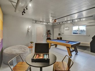 Game room - kick back & relax. Melt into the oversized beanbag and read a book or play a game at the bar top table
