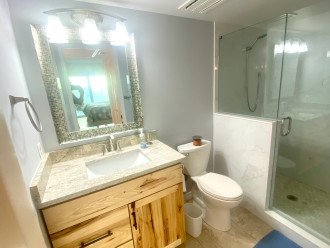 two bathrooms with fine wooden cabinetry