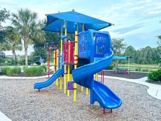 Community Amenities: A playground right outside the clubhouse for kids to run off their energy before bedtime.
