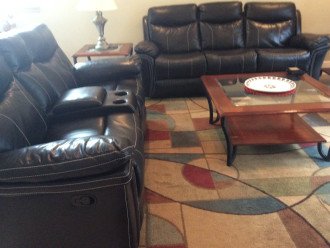 reclining sofa and love seat, auto lights, overhead fans in all rooms