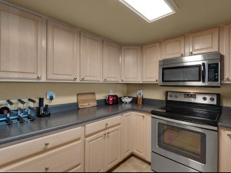 Spacious kitchen is fully stocked with updated inventory.