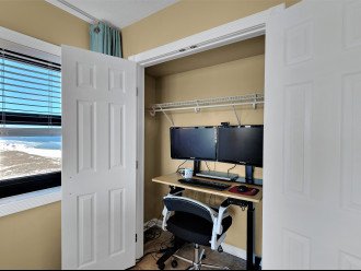 Adjustable height hidden work station w/ dual monitors @ / view