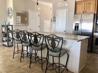 Kitchen with island seating, s/s appliances, granite