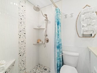 Large walk in shower with Rain shower system , handheld and seat