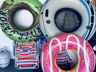 Beach Equipment in Garage: floats, chairs, cooler, umbrella
