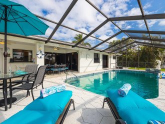 Relax poolside with fully screened-in lanai
