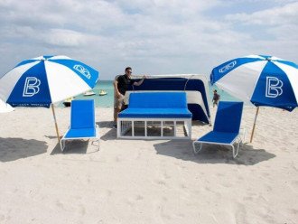Beach resort amenities available with beach chairs and umbrellas