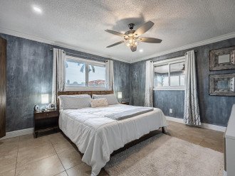 master bedroom with a king size bed