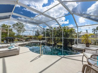 Enjoy canal views as well as the large lanai with heated pool! - Villa Demelo #1