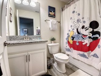 Full bathroom with Mickey Mouse touches.