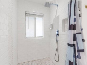 Experience the ultimate shower indulgence with our rainfall shower head, complete with shampoo, conditioner, and body wash for a refreshing and invigorating cleansing experience.