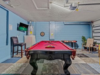 Game room with pool table and other games