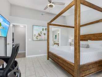 The master suite has a private entrance to the pool and a en suite bathroom.