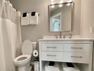 Primary bathroom w/tub & shower. Extra linens & separate make-up remover towels.
