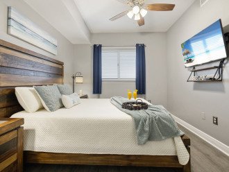 Bedroom 2 offers a queen bed & Tv