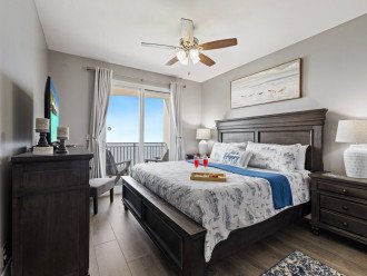 Master Suite offers a king bed, private entrance to balcony, tv & private bath.