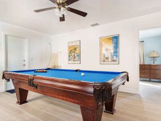 Game room with pool table. Chest full of board games. Bookcase with a small library ofliterature for adults, teens, and children. Purely Pompano has something fun for everyone!