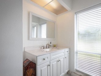 Master bathroom with shower and walk-in closet. Large mirror and vanity, plenty ofstorage space. Relax in a steamy shower after a day of golf at Palm Aire Country Club.