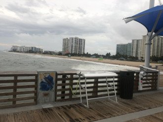 Pompano Beach Fishing Pier with fillet table and rod storage.