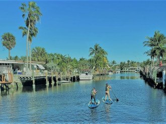 Our back yard, on the "Bahama Canal". |Take a paddle board and a friend to explore the "venetian like" canals of South Florida.