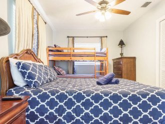Bedroom #4 has a queen-size bed, twin bunk beds, ceiling fan smart TV, dresser. This bedroomshares a “jack and jill” bathroom with bedroom #3.