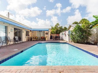 Purely Pompano! Spacious & sanitized 5BD/3BA luxury waterfront offering peaceful respite on ocean-access canal in Cypress Creek Community. Ideal for FL beach vacations, this one-story estate offers pool, patio/BBQ area, game room, fishing dock.