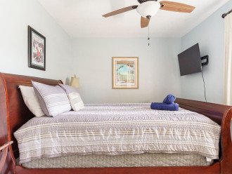 Bedroom 5 Queen Bed with smart TV, Walk in closet, dresser, and shares a bathroom with Bedroom 4(Bunk Bed room).