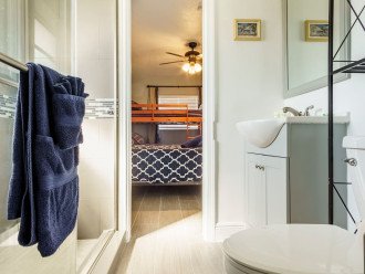 "Jack and Jill" Bathroom with shower and plenty of storage space.