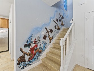 Follow Fantasia Mickey and his magical brooms up our enchanted staircase