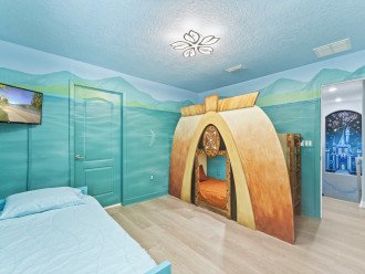 Moana Room sleeps 3 with custom beds, murals, 32" TV, and passage to kids room