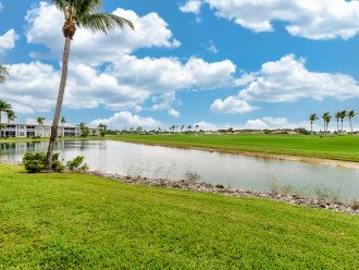 Backyard Of Condo With Lake And Golf Course View;