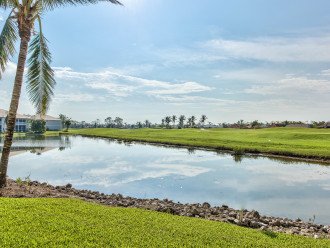 Backyard Of Condo With Lake And Golf Course View;