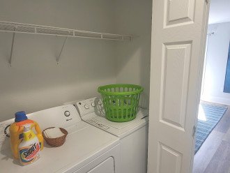 Full size washer and dryer with laundry detergent included in connecting hall