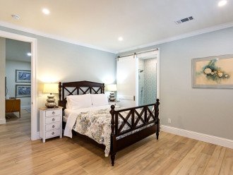 Second bedroom with queen bed and attached bathroom