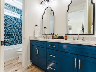 Bunk Room Bathroom: Double Vanity & Tub/Shower and Toilet have a Privacy Door