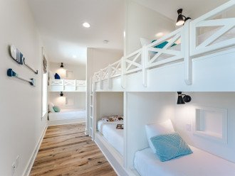 Bunk Room Bunks, 6 of 8 shown here. Each Bunk is designed for privacy and each has a cubby, charging port, and light