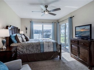 master bedroom with water view and sliding door to lanai