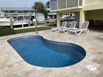Lounge poolside. Approximately 40' dock space available for guests.