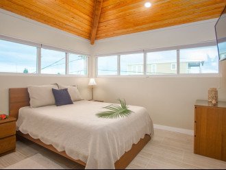 2nd bedroom on top level with a queen bed.