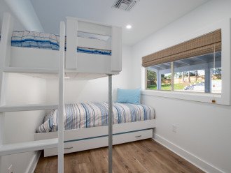 Great space for kids in bunk room featuring XL twin over twin with twin trundle.